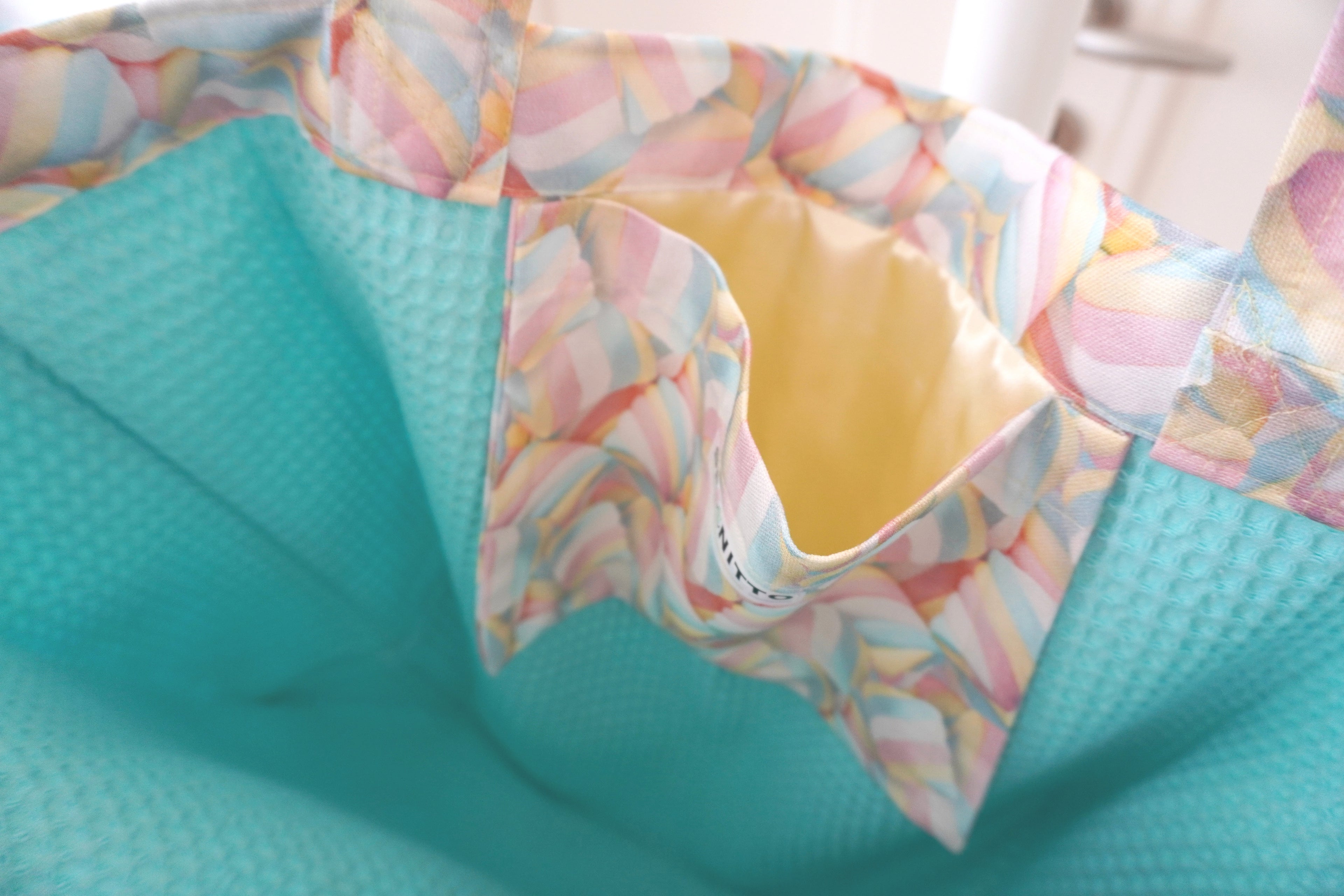 yellow satin bag pocket with colorful marshmallow cover and turquoise waffle cotton base
