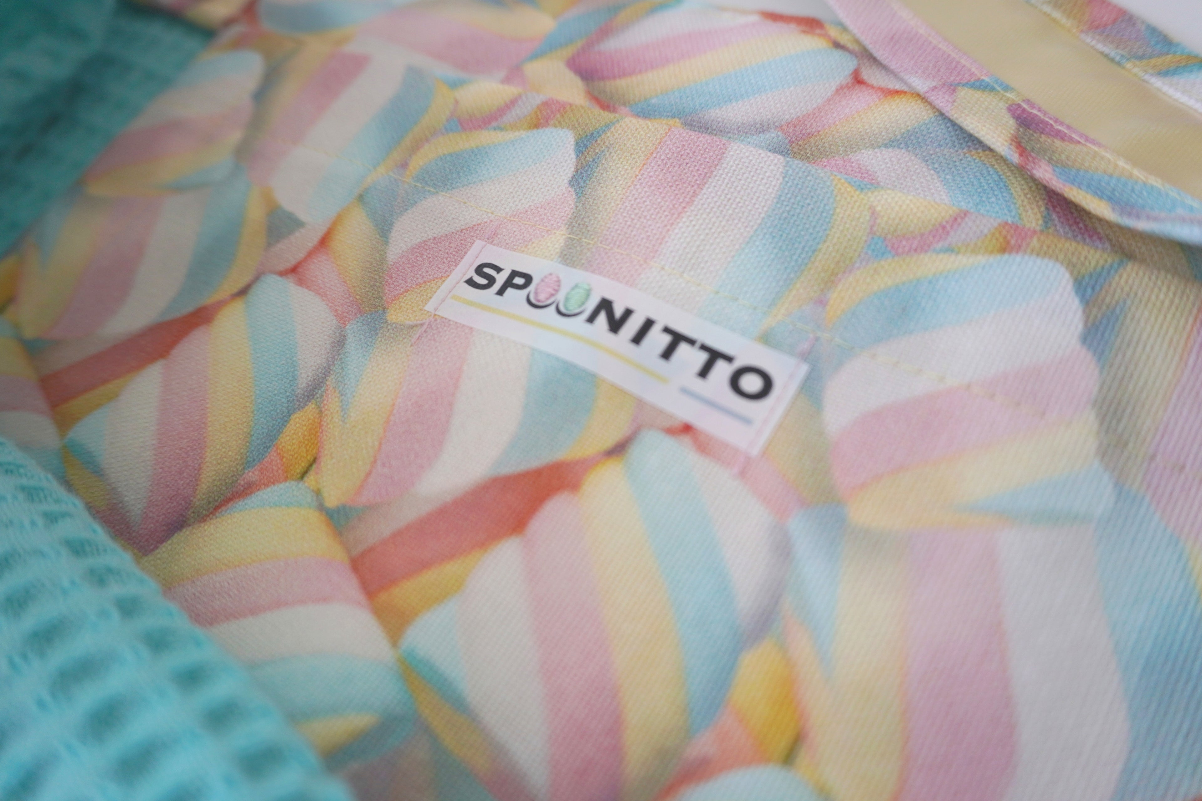 Colorful marshmallow textured fabric with 'SPOONITTO' label