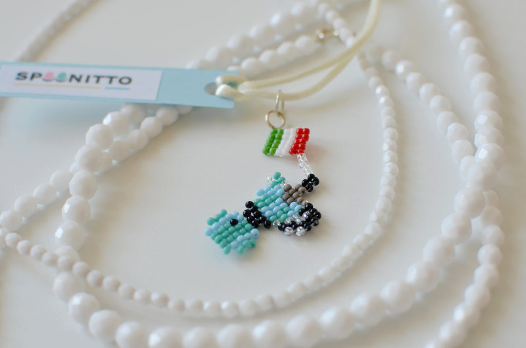 Beaded moka pot pendant with Italian flag design on a white background